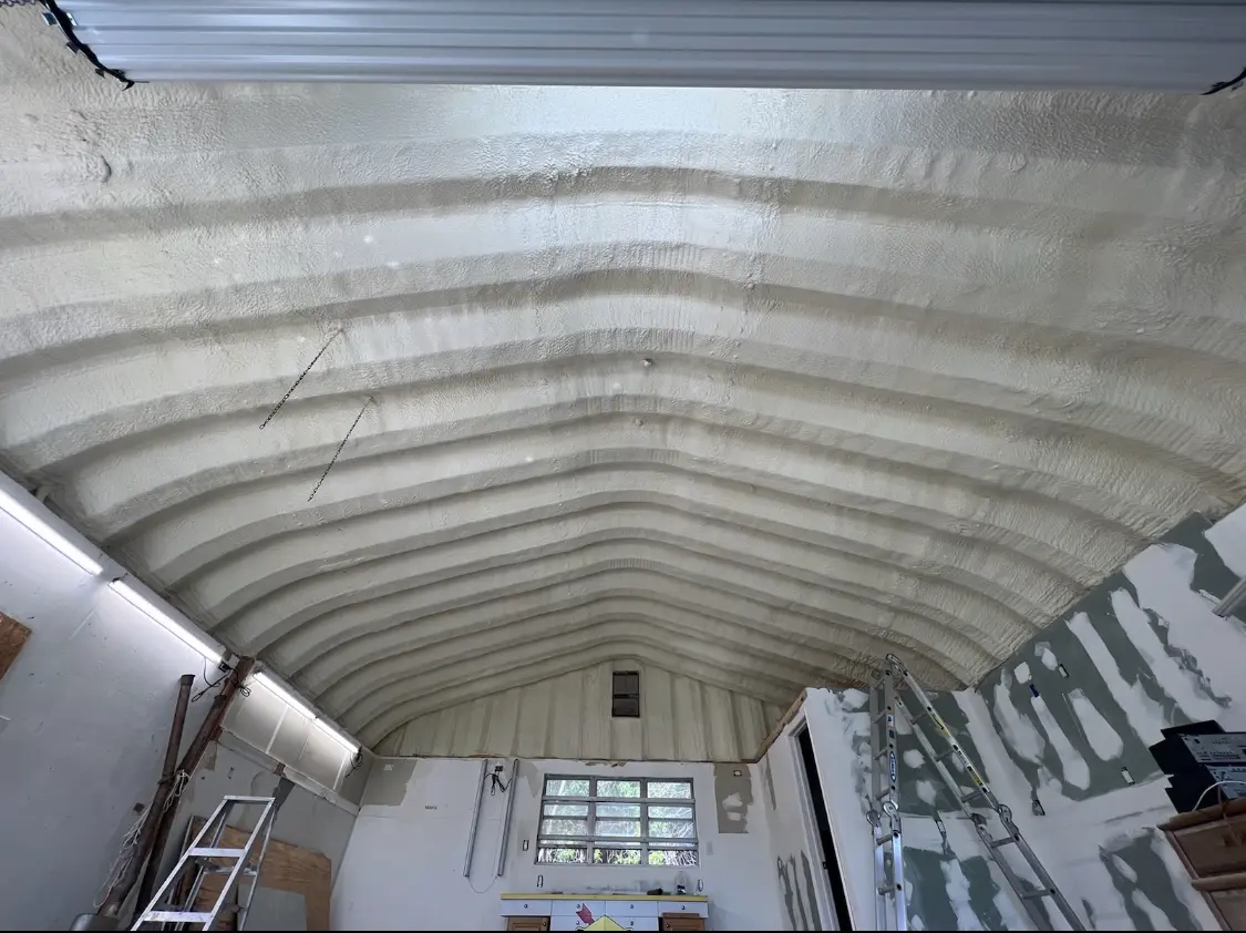 Spray polyurethane foam applied to the underside of a metal roof deck in Shaw Heights